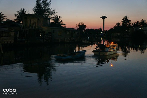 boat with a canddle turn on on the river © Cuba Absolutely, 2014