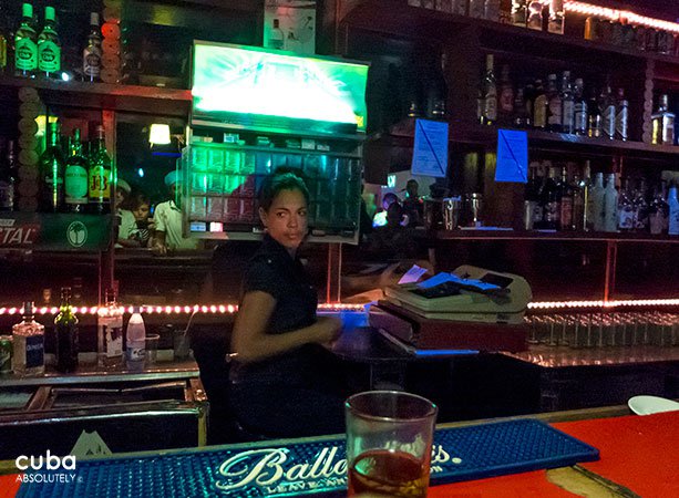 girl behind the bar in Centro Vasco club in Vedado© Cuba Absolutely, 2014