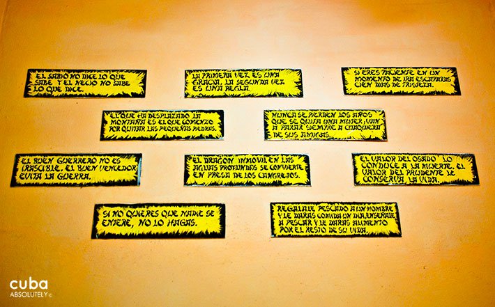 Popular saying on a yellow wall © Cuba Absolutely, 2014