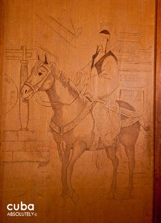 Sketch of a chinese man on a horse in a wood wall © Cuba Absolutely, 2014