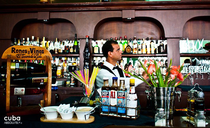 Barman making a drink in a restaurant © Cuba Absolutely, 2014