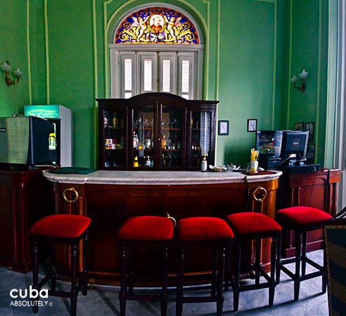 San Miguel hotel in Old Havana, bar in green with red chairs  © Cuba Absolutely, 2014 - 2020