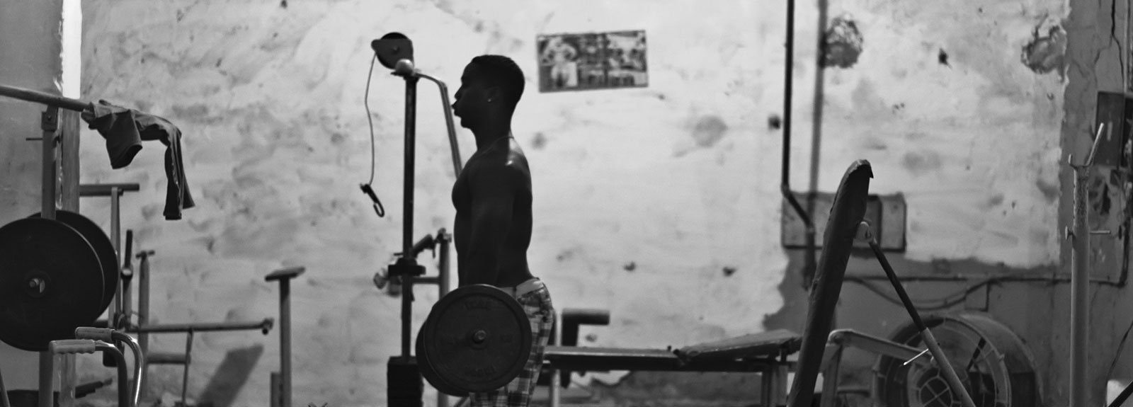 Man doing weights on a gym