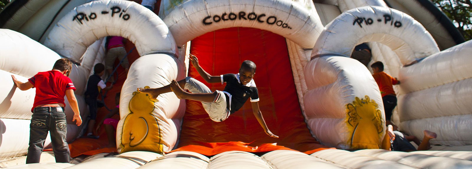 Kids jumping on an inflatable game