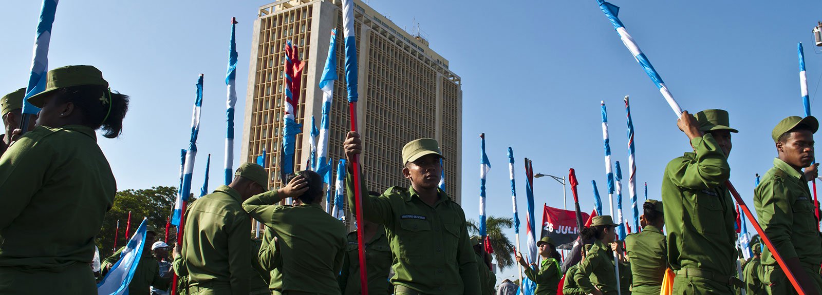 Militars dress in green with cuban flags