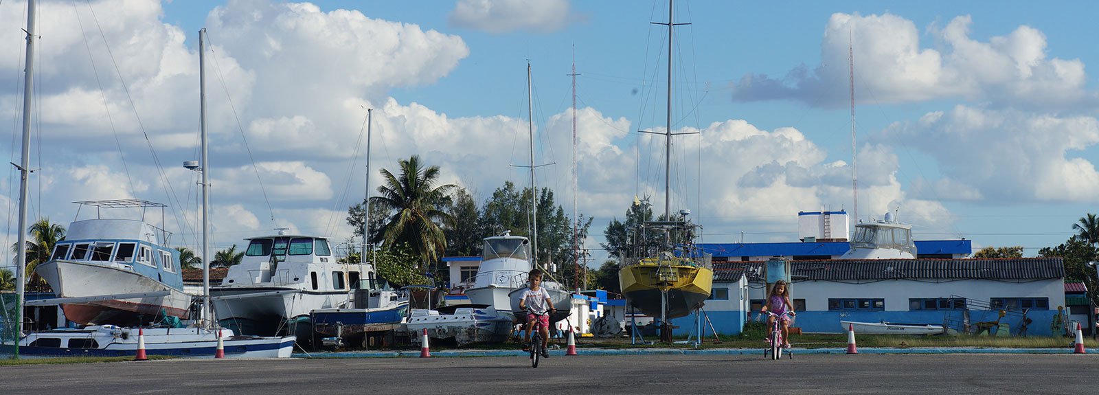 2 kid riding bicycle on Marina Hemingway