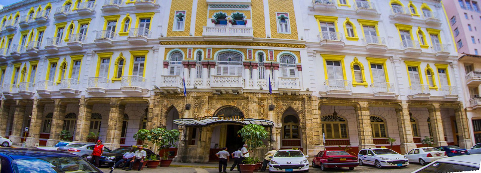 Sevilla hotel front in white and yellow