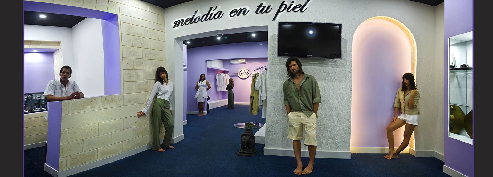 Models in a shop painted in white and violet