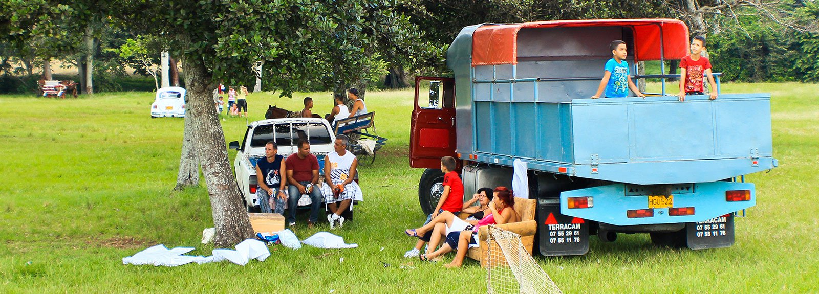 OUTDOOR CAMPING next to a blue truck